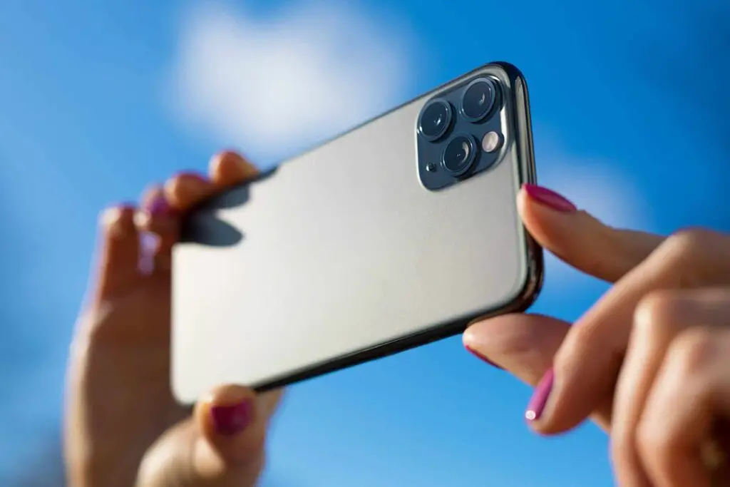 person taking pictures with iphone